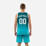 Gradient teal basketball jersey and shorts other side view showing white armhole binding athletic cut and continuous teal to aqua sublimated gradient