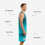 Back view of custom teal basketball uniform showing player name and back number printed on gradient fade jersey with matching aqua shorts