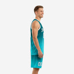 Custom teal basketball uniform front view showing dark teal to aqua gradient jersey with white armhole binding and bold front number on mens athletic cut