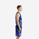 Custom teal and navy basketball uniform front view showing arced team name, front number 00, and V-neck teal binding on male model