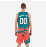 Opposite side view of custom teal basketball uniforms displaying orange contrast binding on the armhole and matching shorts waistband