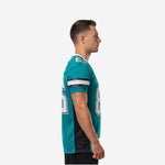 Side view of teal and black custom mens football jersey showing black mesh side panel and double sleeve stripe in white and black