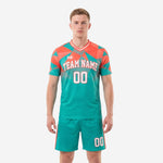 Custom teal and coral geometric soccer uniform front view with team name and number