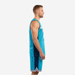 Left side view of ladies basketball uniforms style teal and navy kit showing side panel colorblock