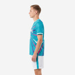 Teal soccer uniform men side profile showing white shorts with teal side stripe and leg number