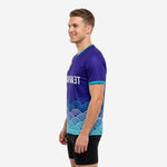 Royal purple teal soccer training jersey with wave hem graphic and teal sleeve cuff trim, right side view