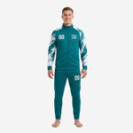 Men's teal soccer tracksuit with white splash-print sleeves and matching tapered pants, front view