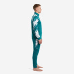 Custom teal and white sublimated soccer tracksuit set, left side profile showing sleeve and pant panel