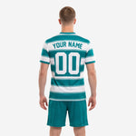 Close detail of teal hooped custom soccer jersey with arched team name and player number sublimation
