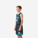 Right side view of charcoal teal sublimated youth basketball jersey and shorts set showing armhole binding and shorts waistband detail