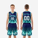 Full set front and back view of custom teal youth basketball uniforms with flame design, jersey and matching shorts