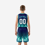 Reverse side view of navy and teal youth basketball uniform showing shorts side split hem detail and flame pattern