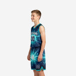 Left side view of teal youth basketball uniform set showing teal armhole binding and shorts hem trim detail