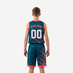 Left side view of custom teal youth basketball uniform showing coral hem band on shorts and continuous diagonal pattern across the set