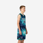 Side view of custom teal and navy youth basketball uniform set showing starburst graphic on jersey and shorts