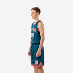 Side view of teal and coral youth basketball uniform set showing slash pattern running across jersey side and shorts leg panel