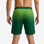 Back view of custom green and lime sublimated basketball shorts with full hex pattern across upper half