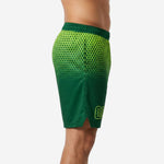 Side view of custom green basketball shorts showing lime yellow hex-fade gradient and side split at hem