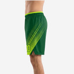 Other side view of travel team basketball shorts in green and neon yellow showing side split at hem and sublimated speed-line design