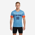Men's v neck training jersey in sky blue with neon orange gradient sleeves and navy team name and number on chest, front view