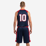 Opposite side view of navy and red men's custom basketball uniforms showing the red side panel detail running the full length of the shorts leg