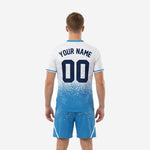 Sky blue and white soccer jersey chest detail showing sublimated team name front number and K2 crest badge placement