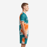 Full kit view of men's vivid teal and orange custom soccer uniform set with matching jersey and shorts