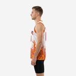 Side view of white and orange custom basketball jersey showing orange armhole binding and flame graphic wrapping the lower body