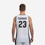 Close-up side detail of the navy and gold side panel construction on a custom white sublimated basketball jersey