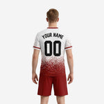 Close detail of white and dark red dot-burst sublimated soccer jersey with V-neck dark red trim and cuff stripe