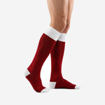 Side view of custom red socks soccer showing dark red over-the-calf body and white contrast heel section on adult male