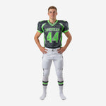 Custom white youth football uniforms in charcoal and neon green showing front number, team name, V-collar jersey and white pants with side stripe, youth sizes
