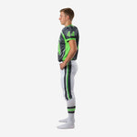 Right side view of custom white and charcoal youth football uniforms showing jersey side panel seam detail and pant side stripe in green and charcoal
