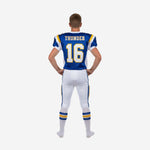 Back view of white youth football uniform showing back number and nameplate on royal blue jersey with white pants