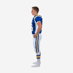 Reverse side view of white youth football uniform showing royal blue jersey with gold shoulder accent and white pants stripe
