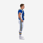 Side view of white youth football uniform showing royal blue and gold double side stripe on pants and white jersey side panel