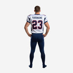 Back view of white and navy custom American football uniform showing back number placement, nameplate area, and white side stripe on navy pants