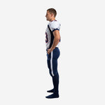 Second side view of white and navy sublimated American football uniform set showing jersey taper and full-length navy pants construction