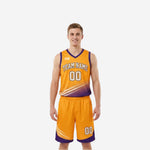 Gold side of reversible basketball uniform set with purple trim and diagonal graphic, matching gold shorts with purple hem, front view