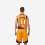 Gold side of custom reversible basketball uniform showing V-neck and armhole binding detail, side view