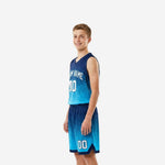 Side angle of custom blue and white youth basketball uniforms highlighting wide armholes and V-neck jersey cut with matching shorts