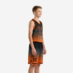 Youth basketball uniforms with names and numbers showing orange arced team name and front number on black-to-orange gradient jersey and matching shorts