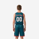 Second side view of personalized youth basketball uniforms in teal with coral binding and diagonal stripe detail