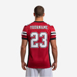 Left-side view of custom red and black youth league football jersey showing sleeve stripe band and mesh fabric texture