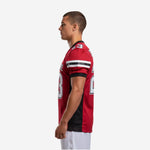Right-side view of red and black sublimated youth football jersey showing set-in sleeve construction and black torso side panel