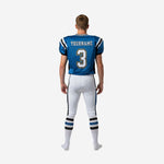 Back view of breathable youth football uniforms showing royal blue jersey body, black shoulder panel, back number placement, and full-length white football pants with 3-stripe side panel