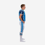 Blue and white youth football uniform side view showing navy shoulder panel, white vertical side panel on jersey, and matching pants with sky-blue and navy leg stripe