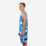 Side view of kids basketball team uniforms in sky blue cloud pattern showing white side stripe and V-notch shorts hem detail