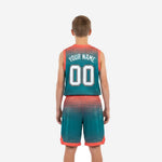 Back view of custom youth sublimated basketball uniforms in teal with orange trim, showing back number placement and matching shorts