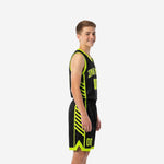 Side view of black and neon lime youth tournament basketball uniform showing diagonal sublimated slash panels on jersey and shorts with neon chevron hem detail